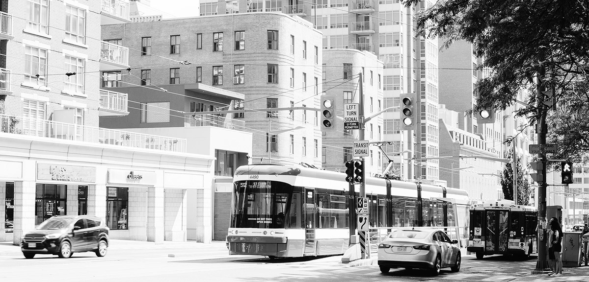 The St. Clair Avenue streetcar travelling through traffic in Toronto, Ontario.
